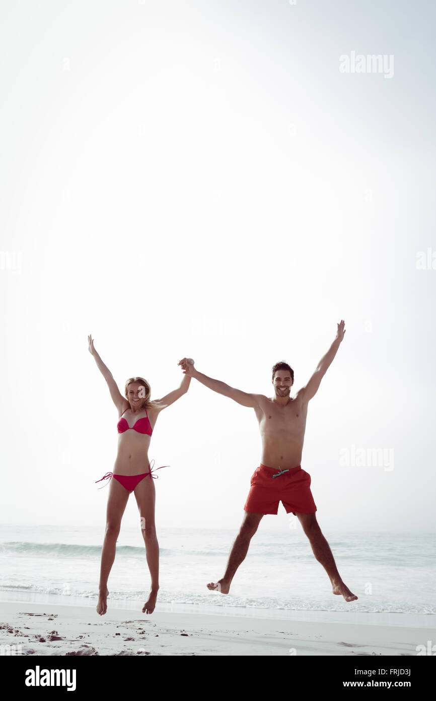 Happy couple jumping together Stock Photo