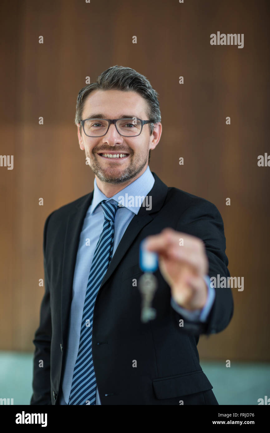 Real estate agent holding key Stock Photo Alamy