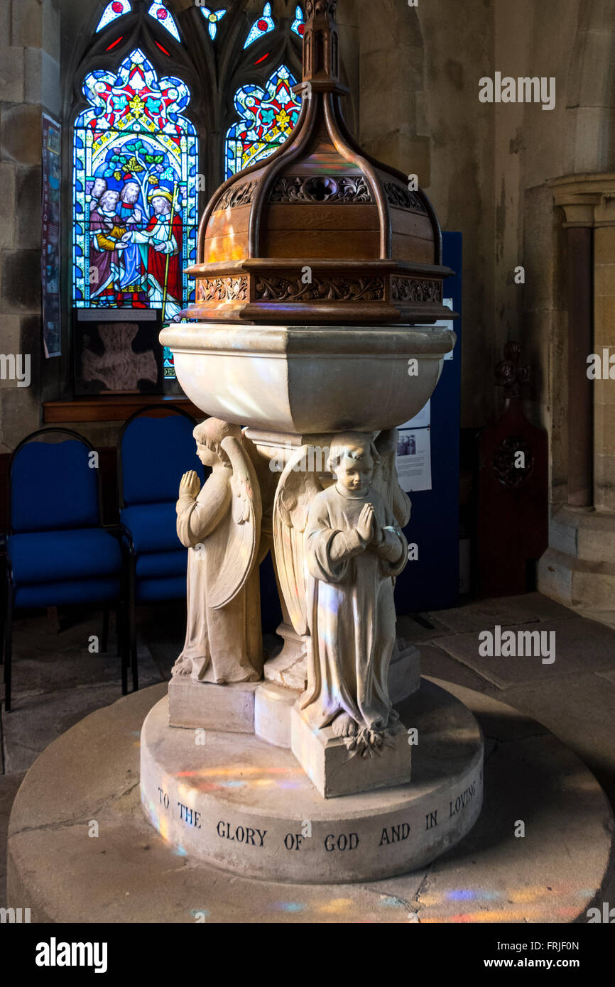 Baptismal font at the Church of St. Andrew, Aysgarth Falls, Wensleydale, Yorkshire Dales, England, UK. Stock Photo