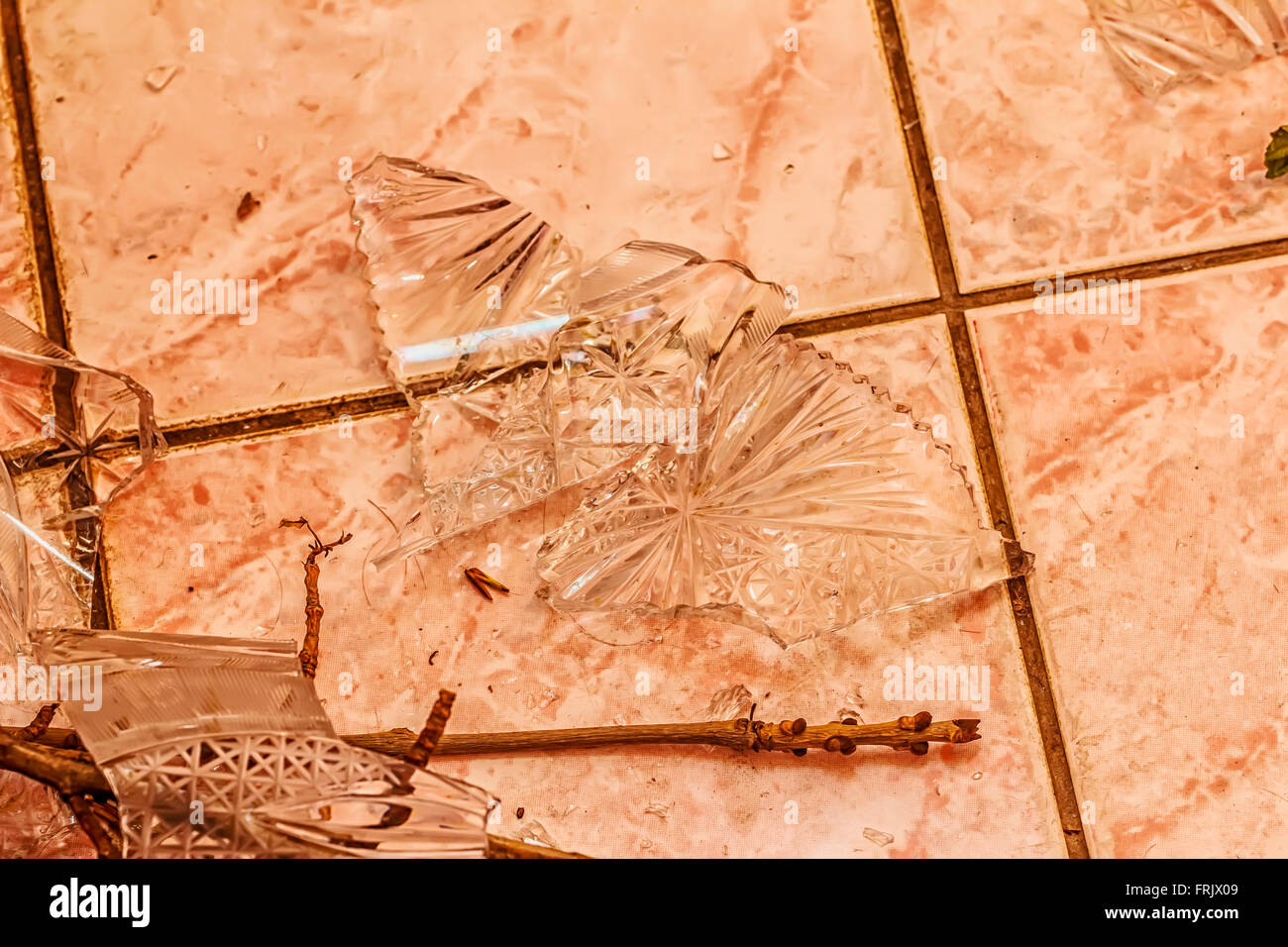 Shards of broken crystal vase on floor Stock Photo Alamy