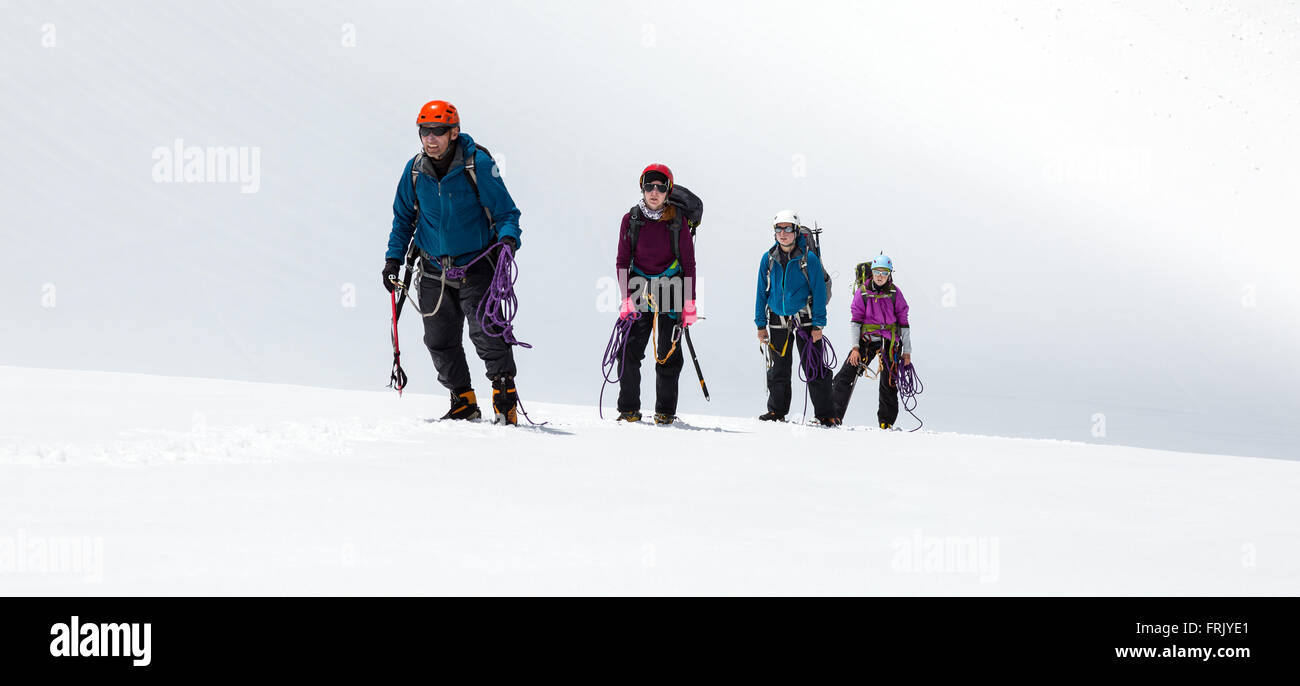 Group of Climbers Approaching to Summit Stock Photo