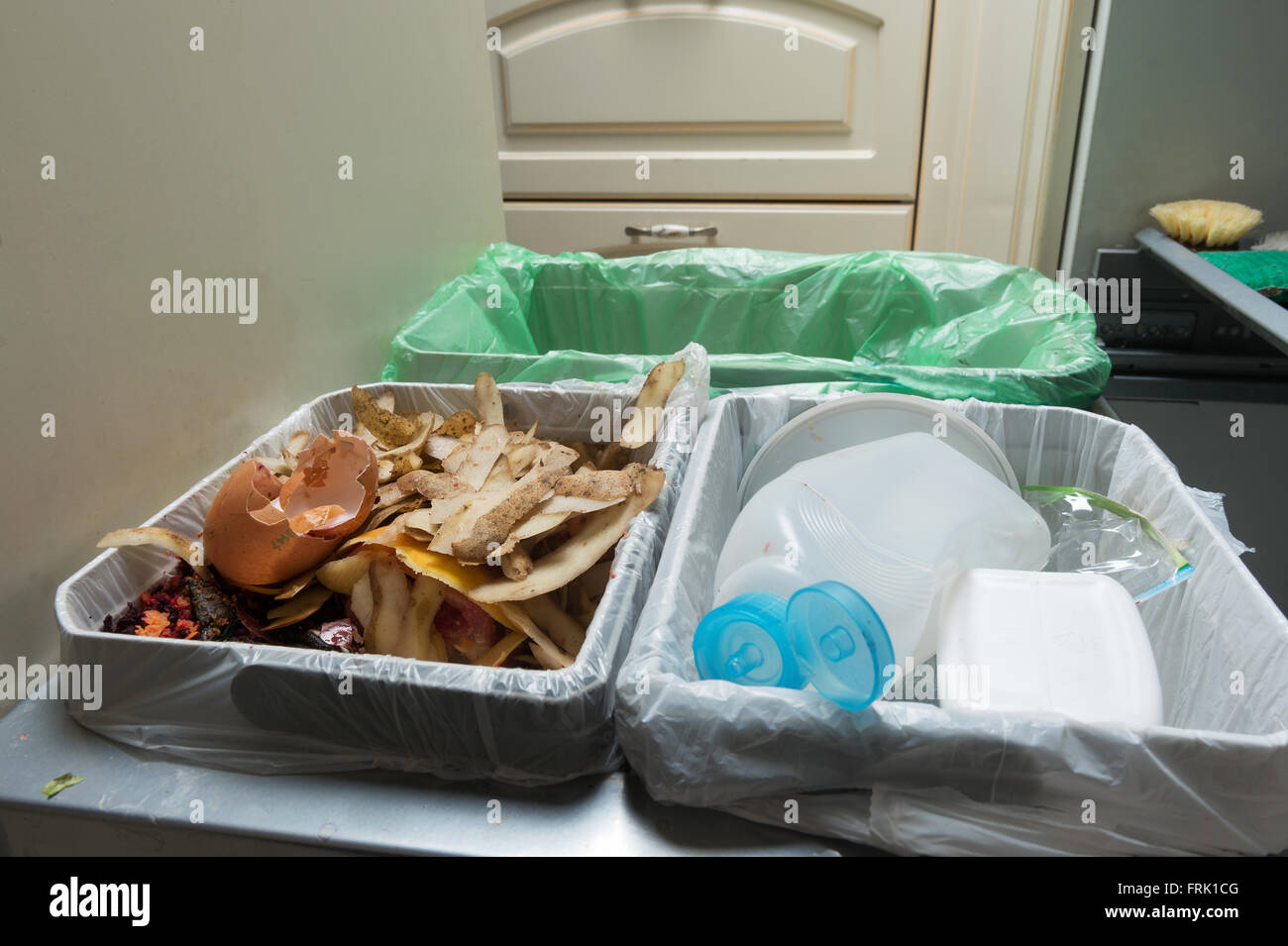 Household waste sorting and recycling kitchen bins in the drawer. Environmentally responsible behavior, ecology concept. Stock Photo