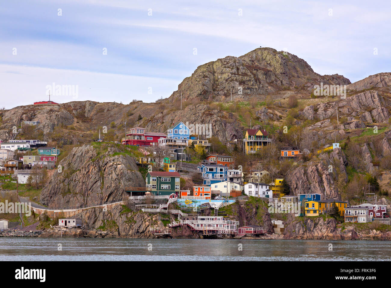 'The Battery' a neighbourhood in St. John's, Newfoundland, Canada, seen from across St. John's Harbour in the spring. Stock Photo