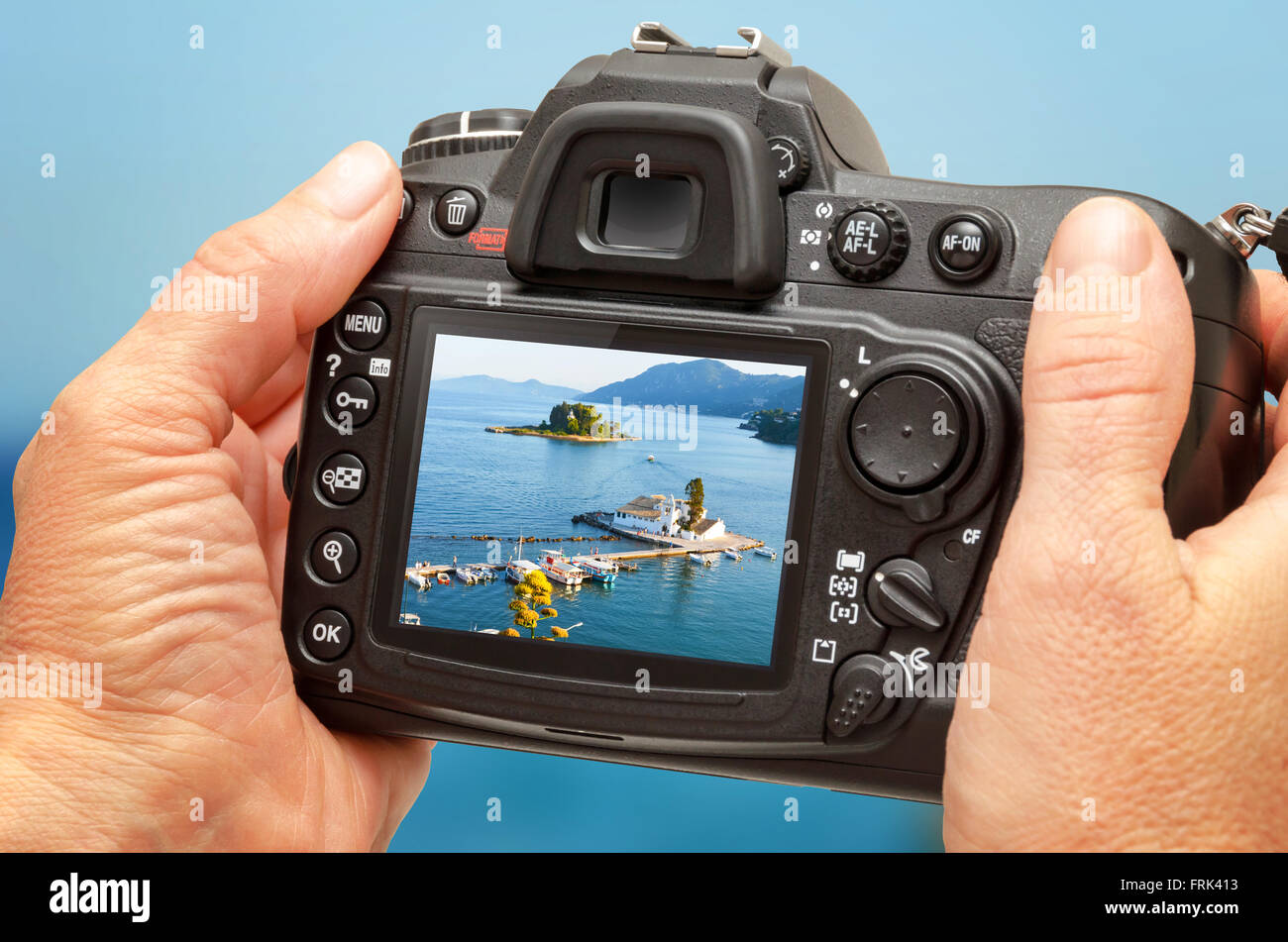 Photo of church and sea on camera display during the summer vacation. Travel photography Stock Photo