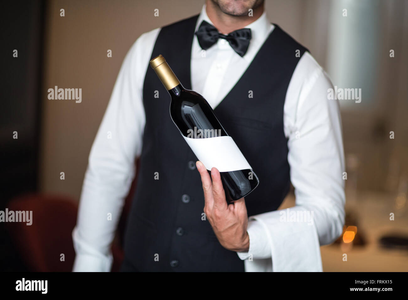 Waiter presenting red wine Stock Photo Alamy
