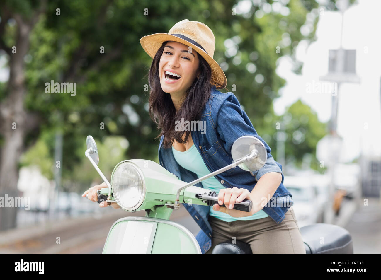 Portrait of woman on moped Stock Photo Alamy