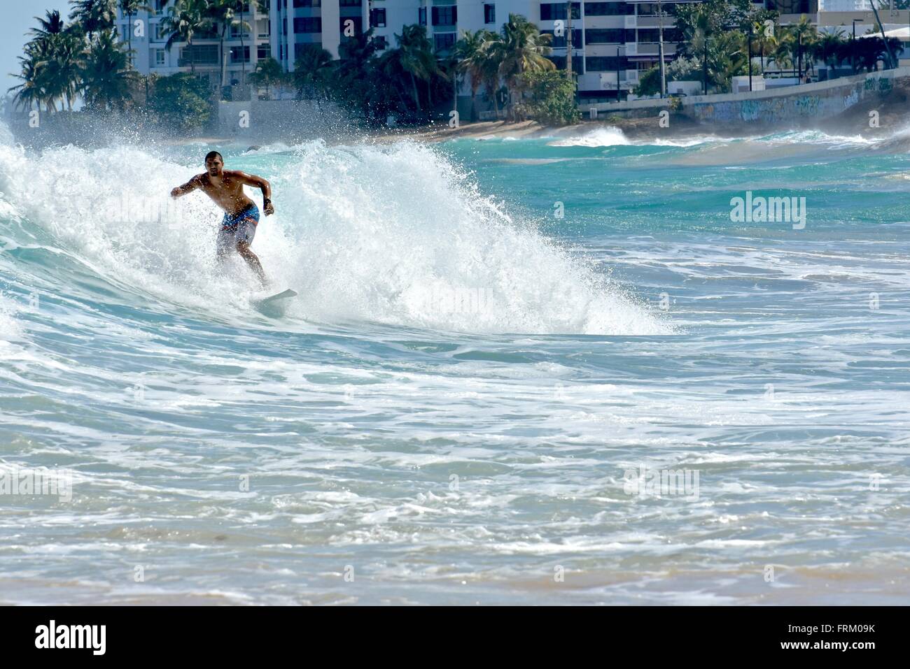 Surfer riding waves at Condado beach in Puerto Rico Stock Photo Alamy