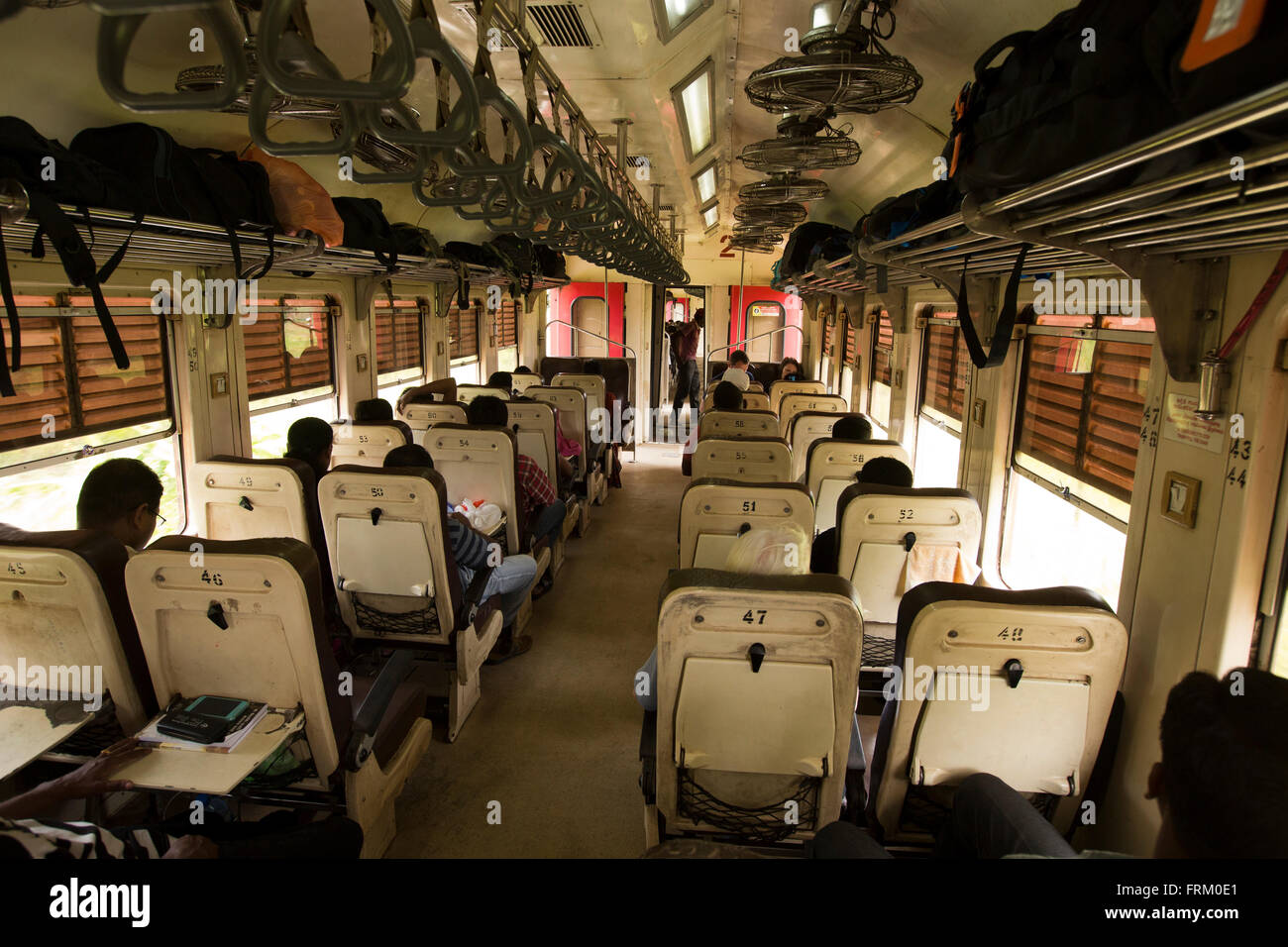 Sri Lanka, Colombo, train travel, passengers in second class carriage on inter city route Stock Photo