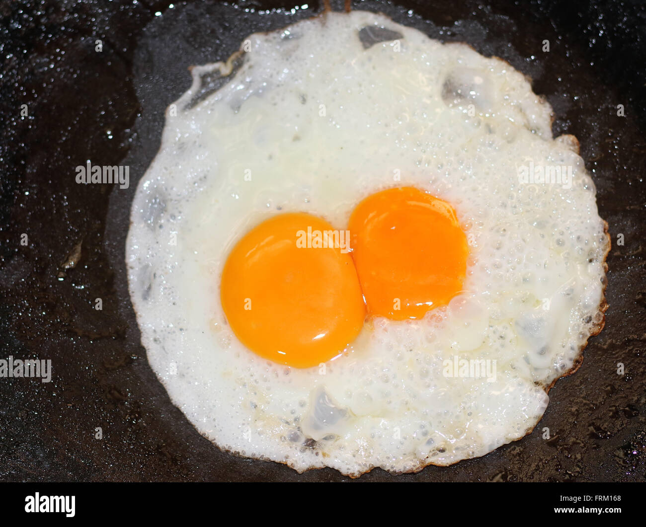 Fresh eggs/Half fried eggs Stock Photo Alamy