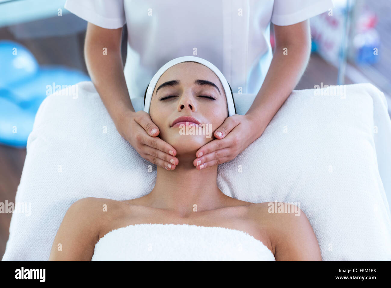 Woman receiving a face massage Stock Photo Alamy