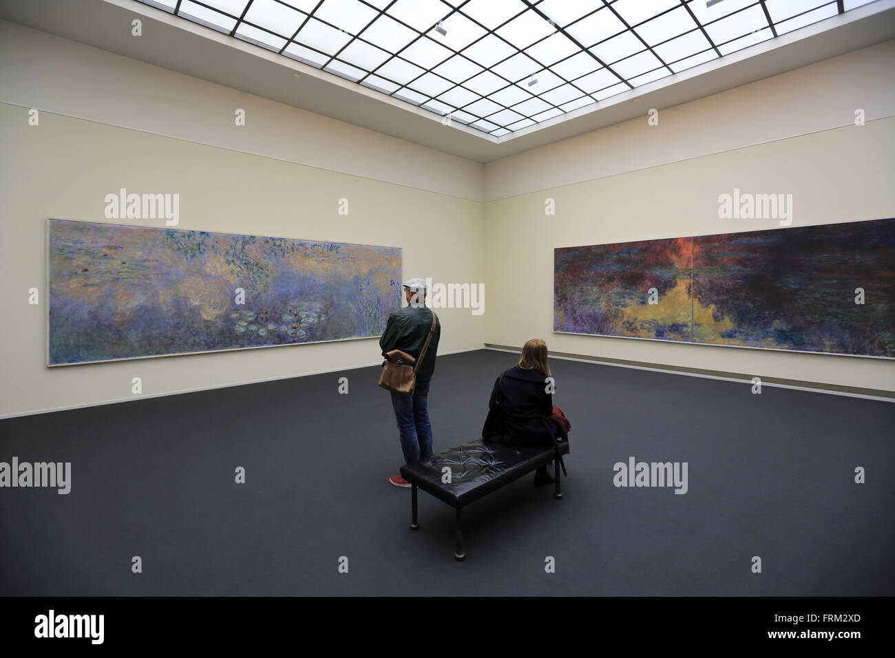 visitors looking at Claude Monet's Les Nympheas water lilies in the Kunsthaus Zurich, Switzerland Stock Photo
