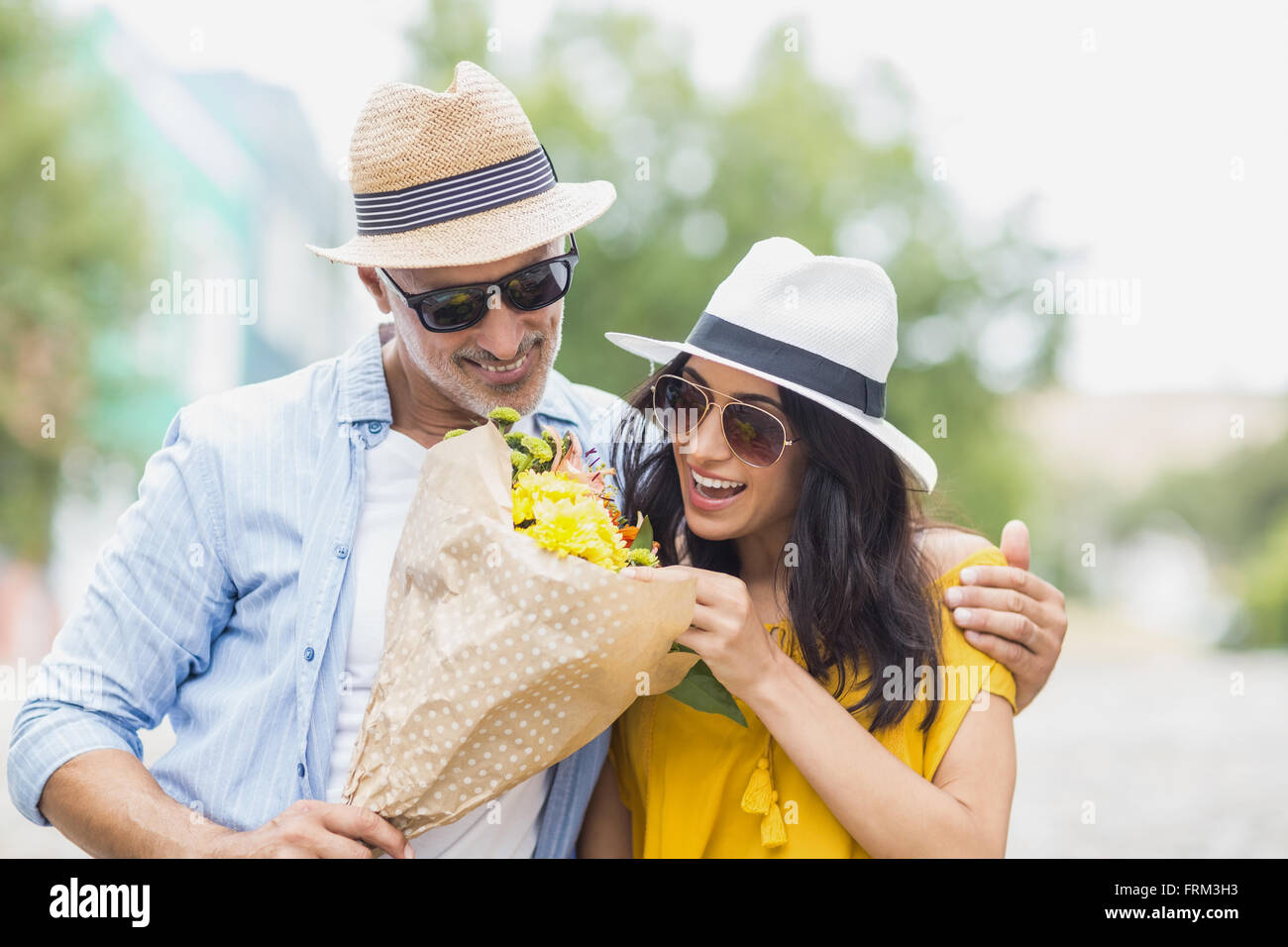 Hispanic young couple flowers hi-res stock photography and images - Alamy