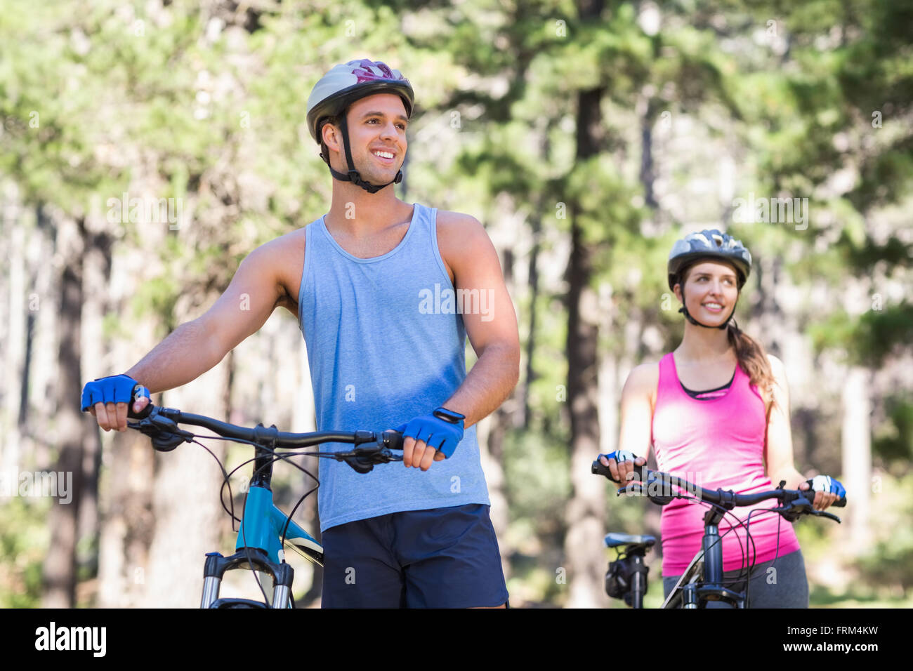 Healthy man and woman with bicycles Stock Photo