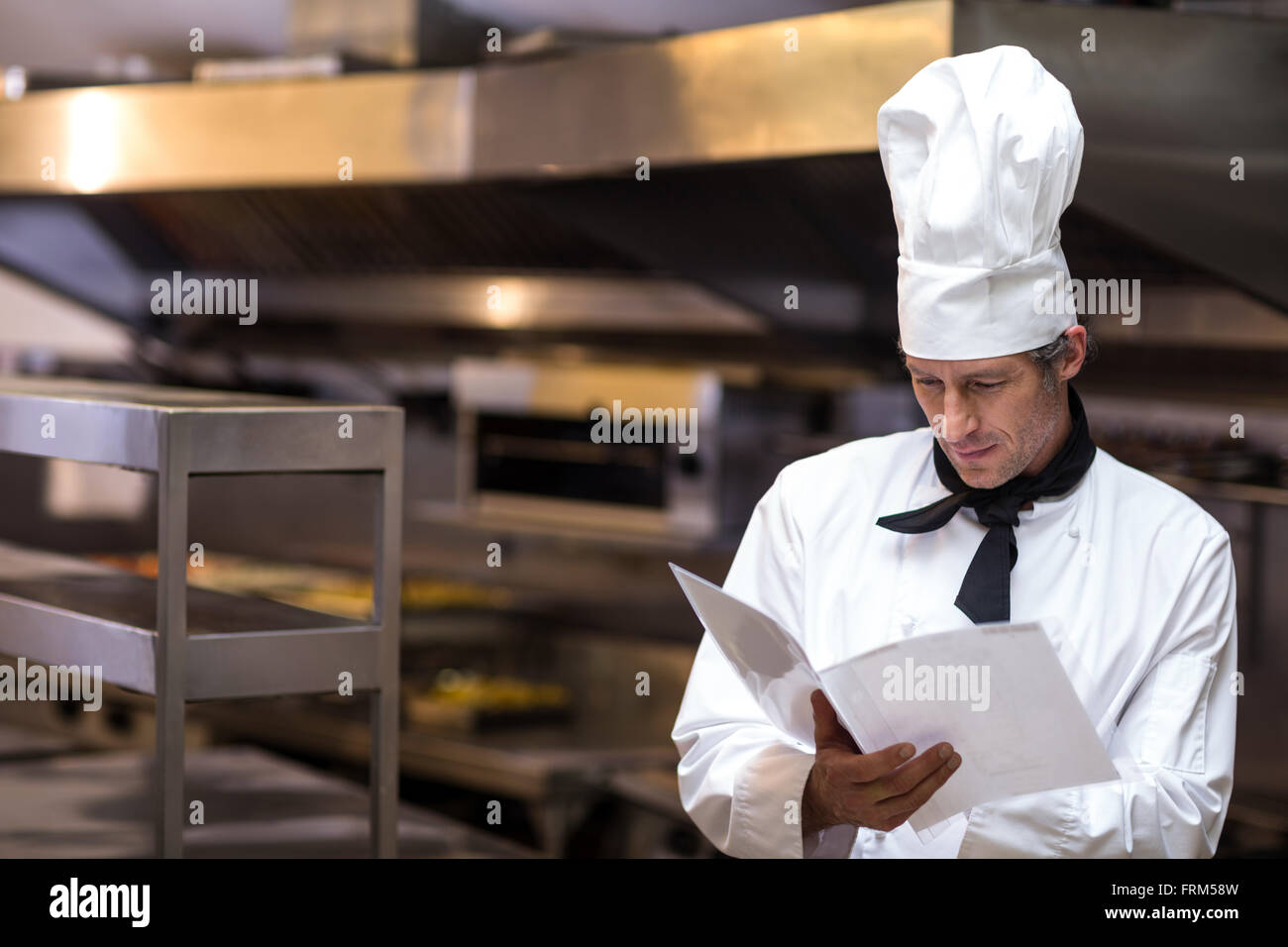 Mature male chef reading hi-res stock photography and images - Alamy