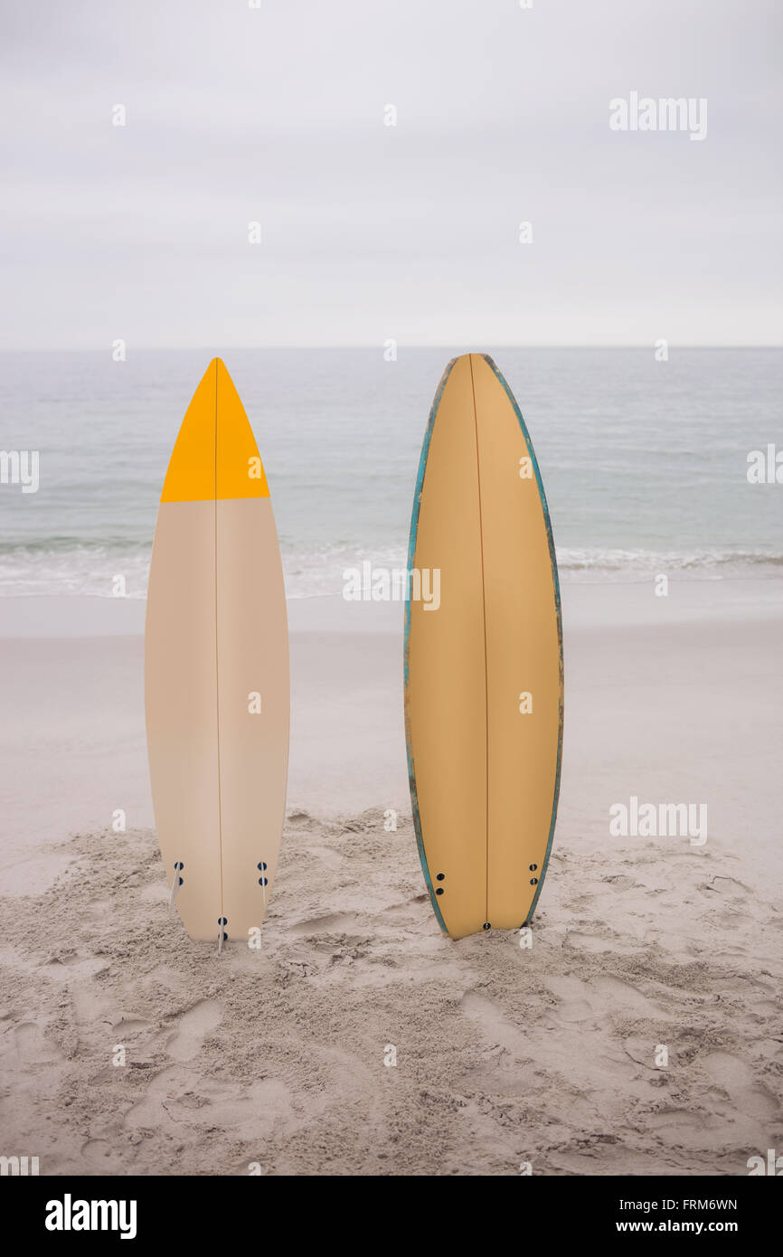 Two surfboard standing in sand Stock Photo Alamy