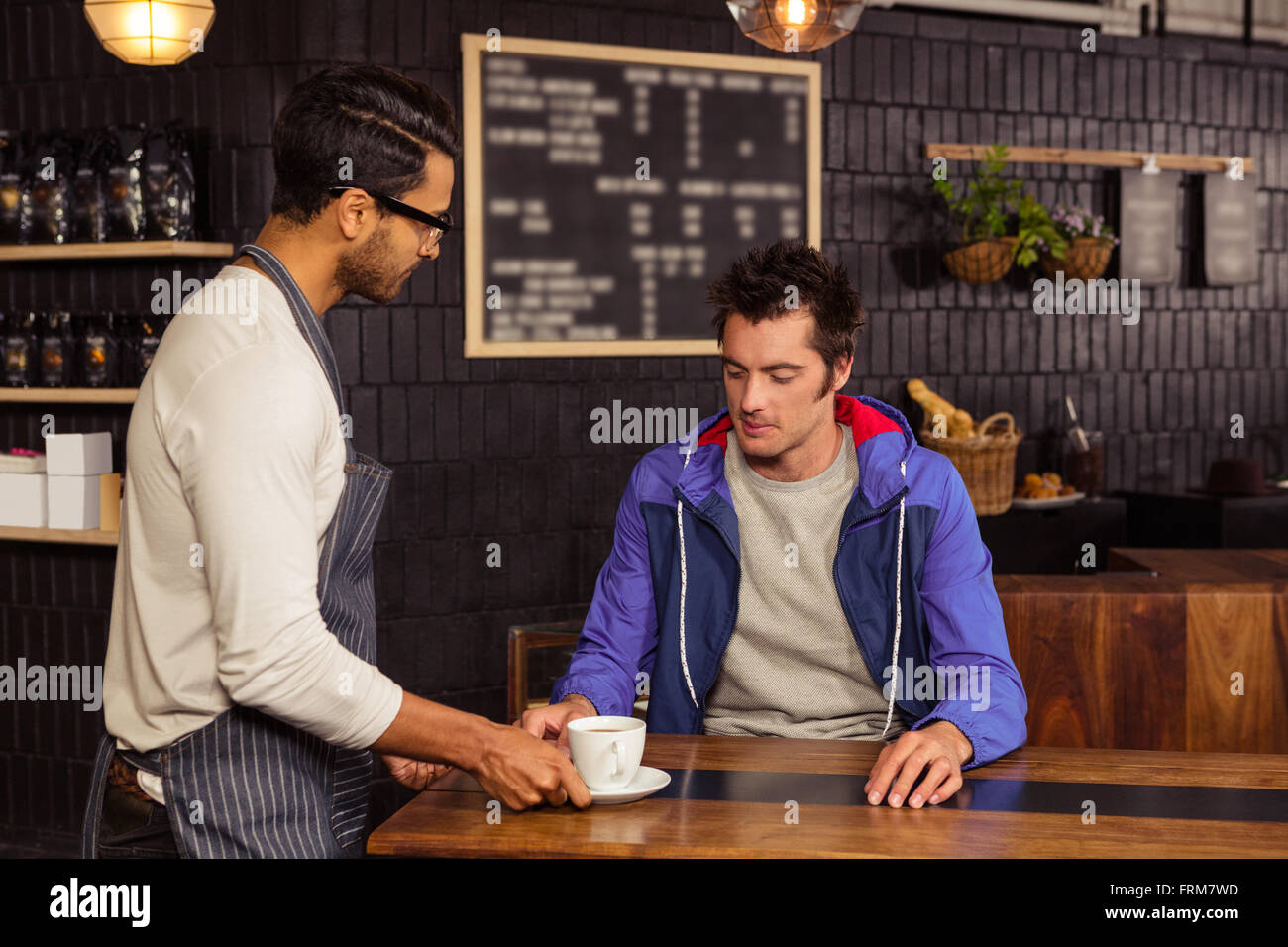 Waiter serving a coffee Stock Photo Alamy