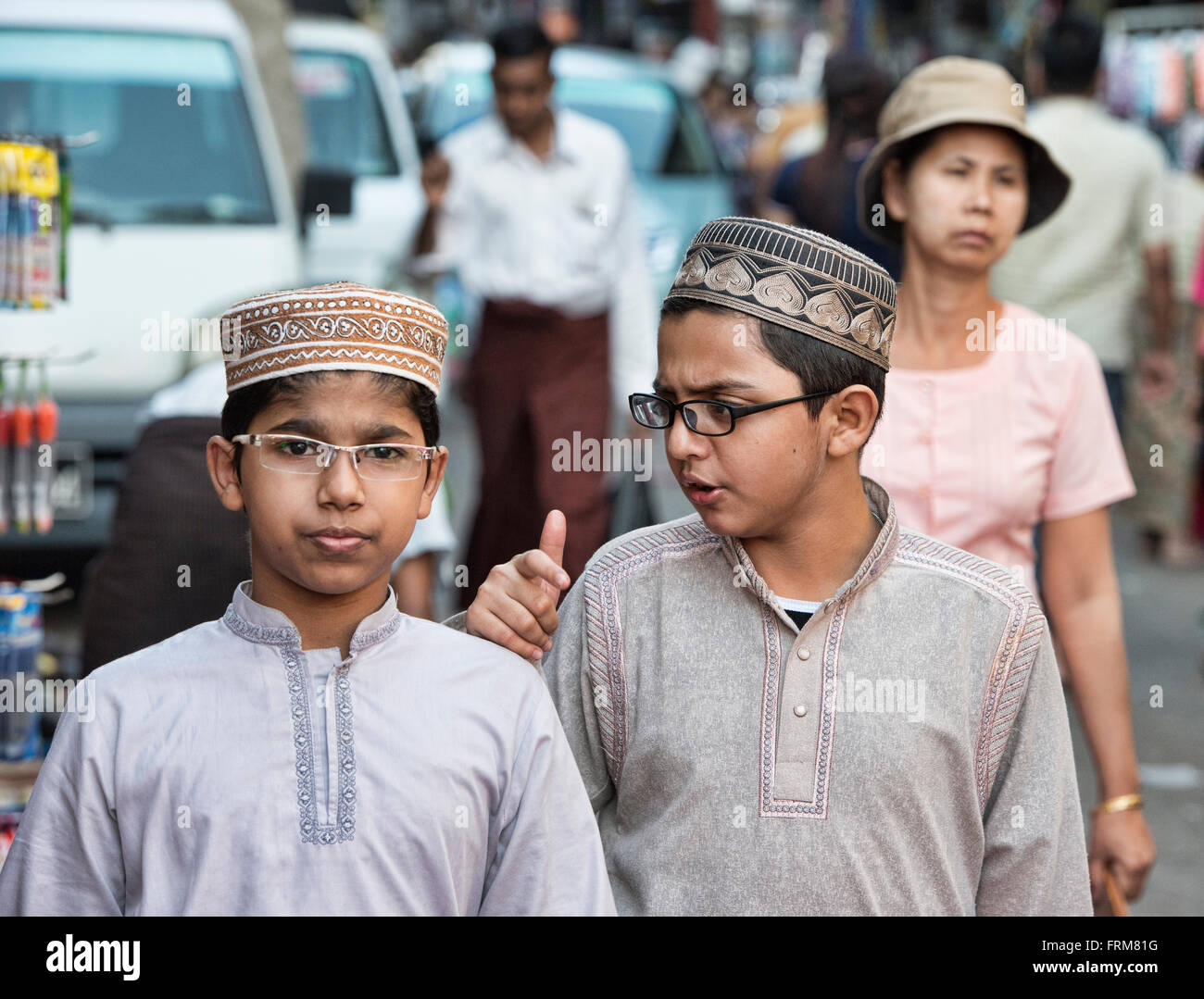 Moslem boys walking in Yangon, Myanmar Stock Photo