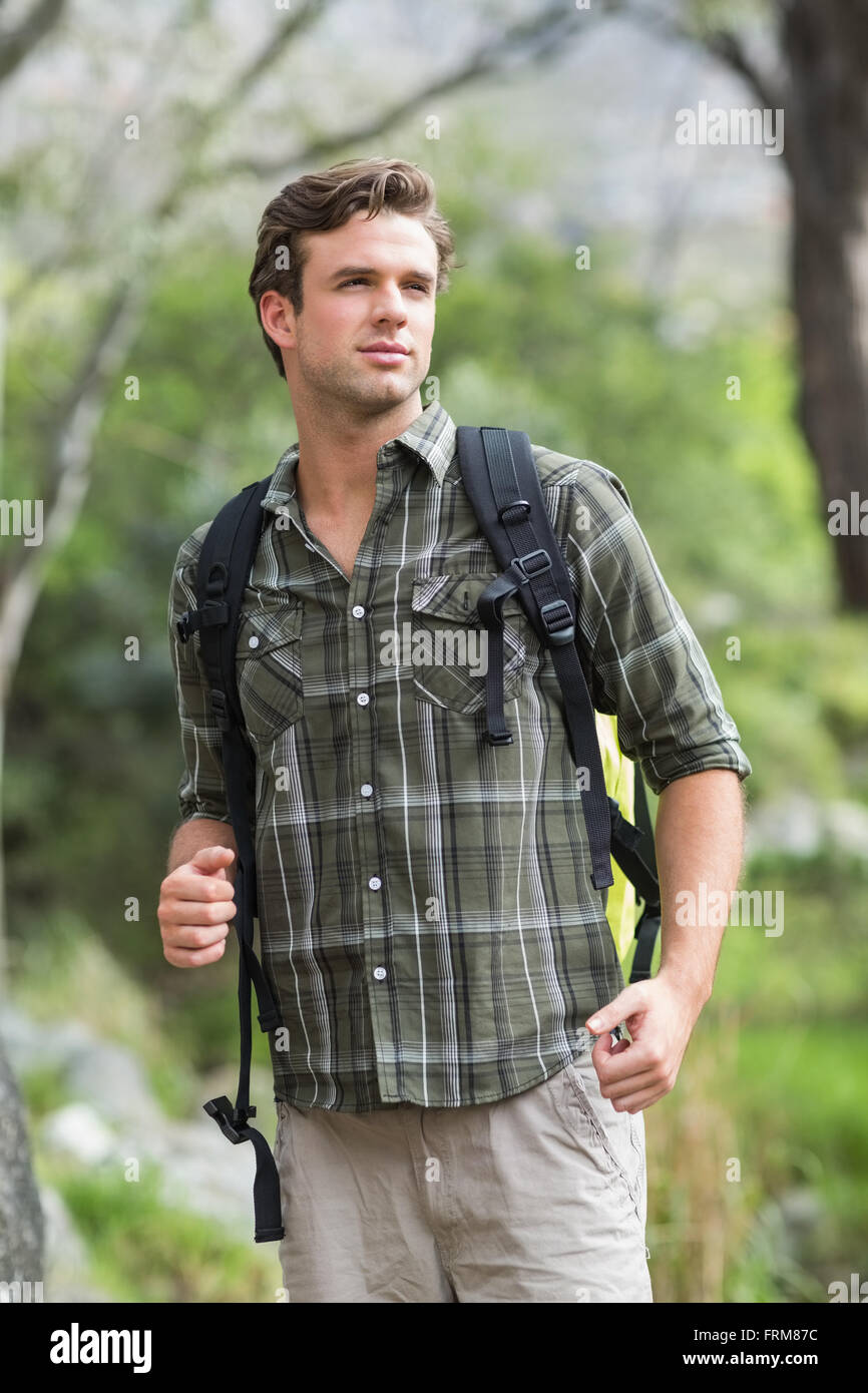Handsome young man hiking in forest 20s adult hi-res stock photography ...