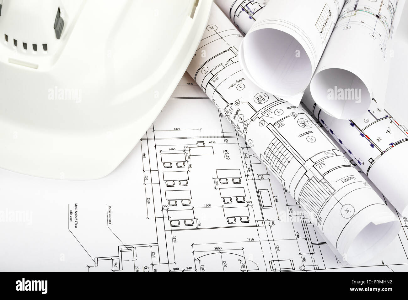 Architecture plan and rolls of blueprints Stock Photo - Alamy