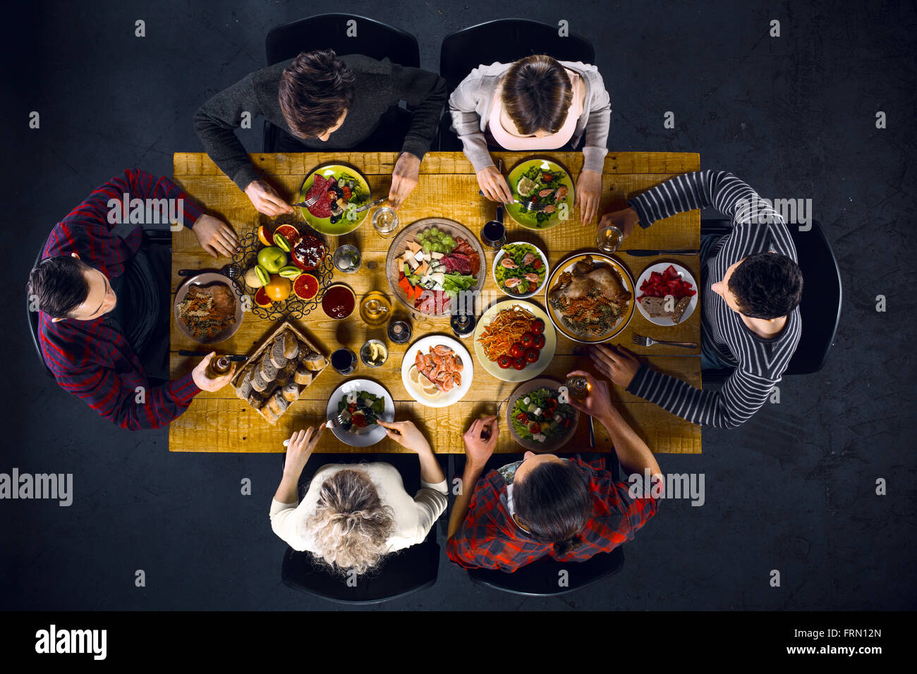 Top view of friends at table with food Stock Photo - Alamy