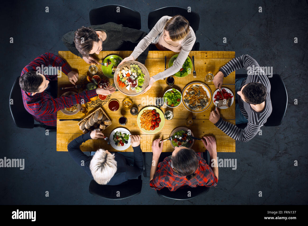 Top view of friends at table with food Stock Photo - Alamy