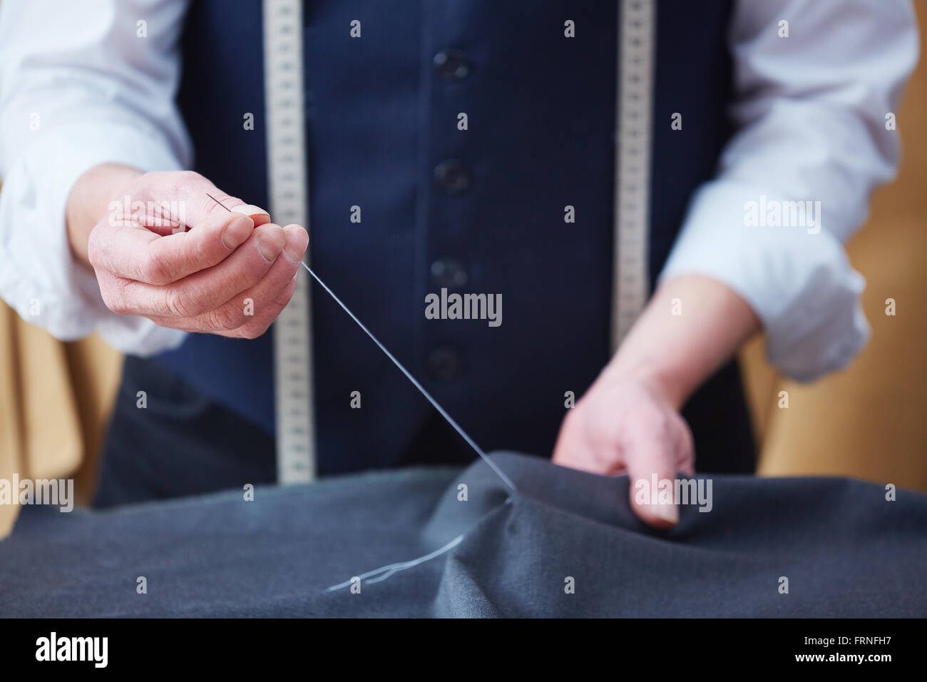 Tailor sewing Stock Photo
