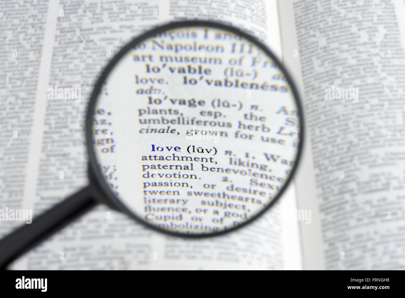 The Word Love In A Dictionary Seen Through A Magnifying Gl Shallow D O F The Word Love In A Dictionary Seen Through A Magnifying Gl Shallow D O F