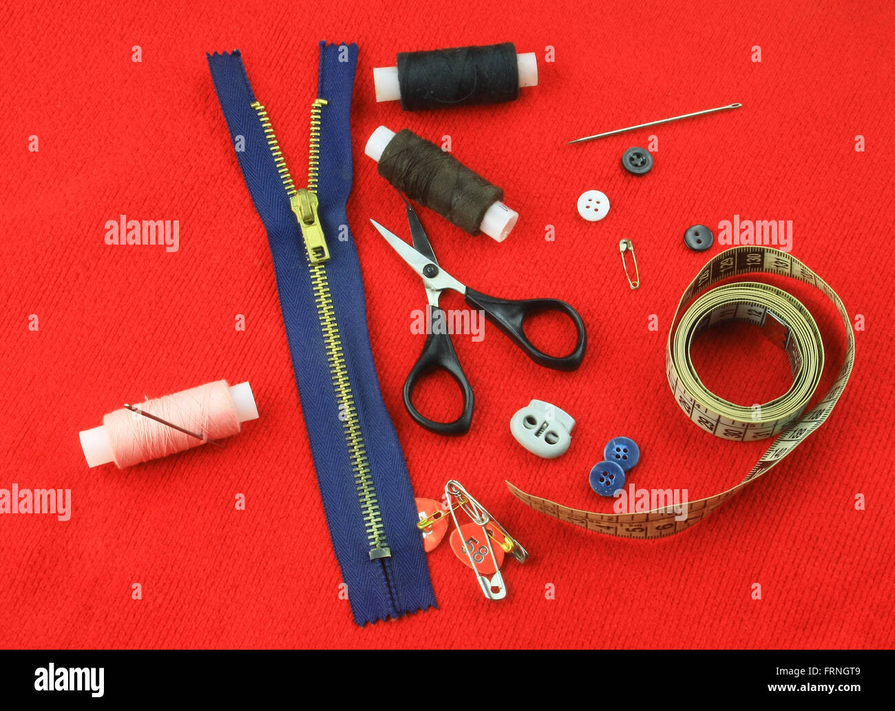 Tailoring accessories on red cloth Stock Photo