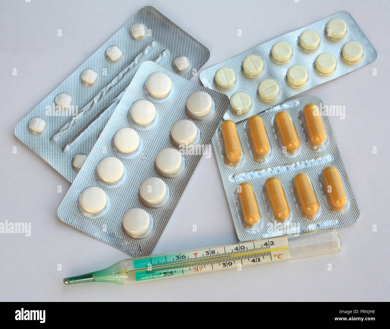 thermometer and pills disease theme Stock Photo