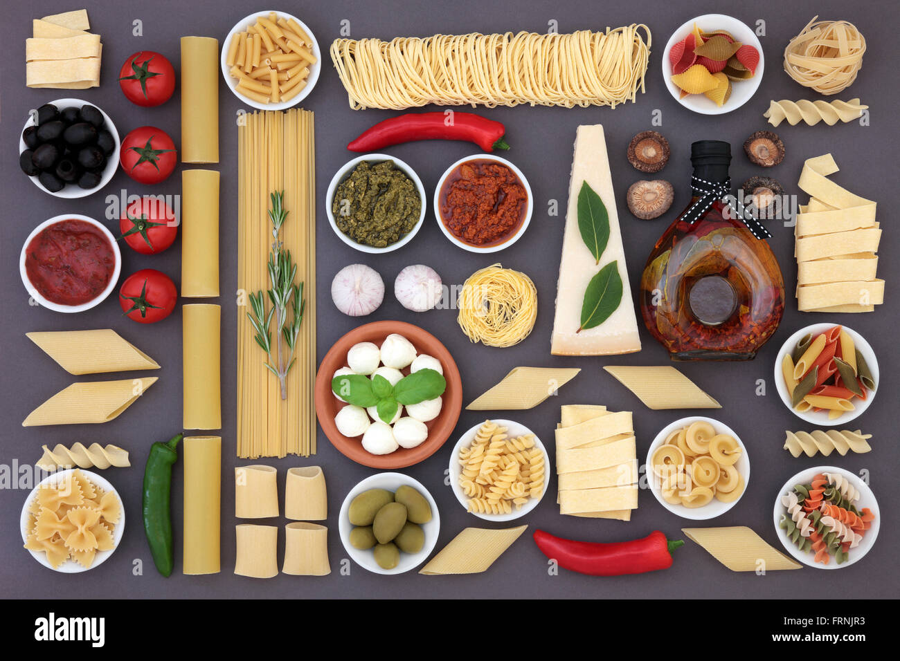 Healthy Mediterranean diet and food ingredients forming an abstract background over grey. Stock Photo