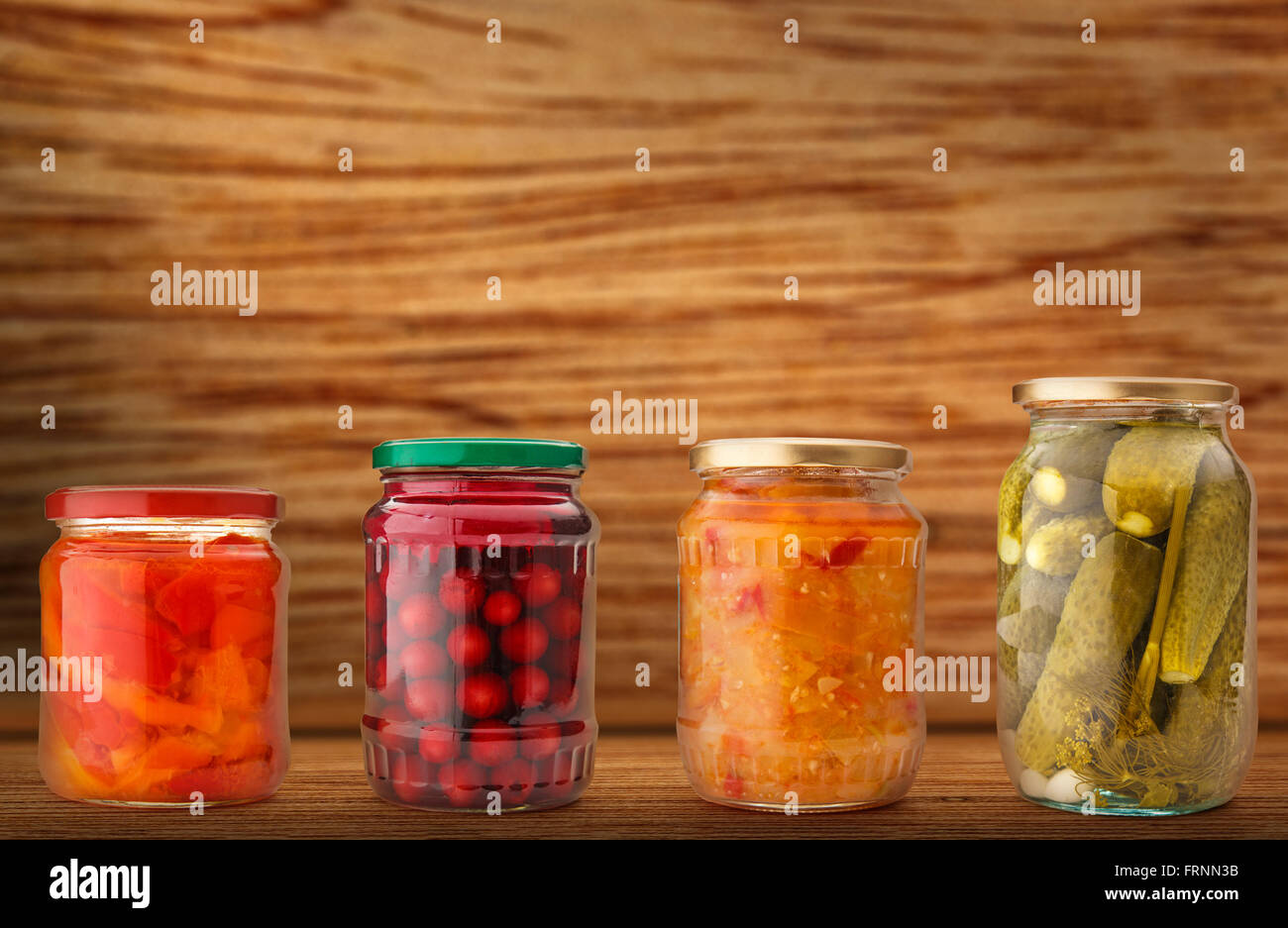 Pickled vegetables in jars on shelf in closeup Stock Photo Alamy