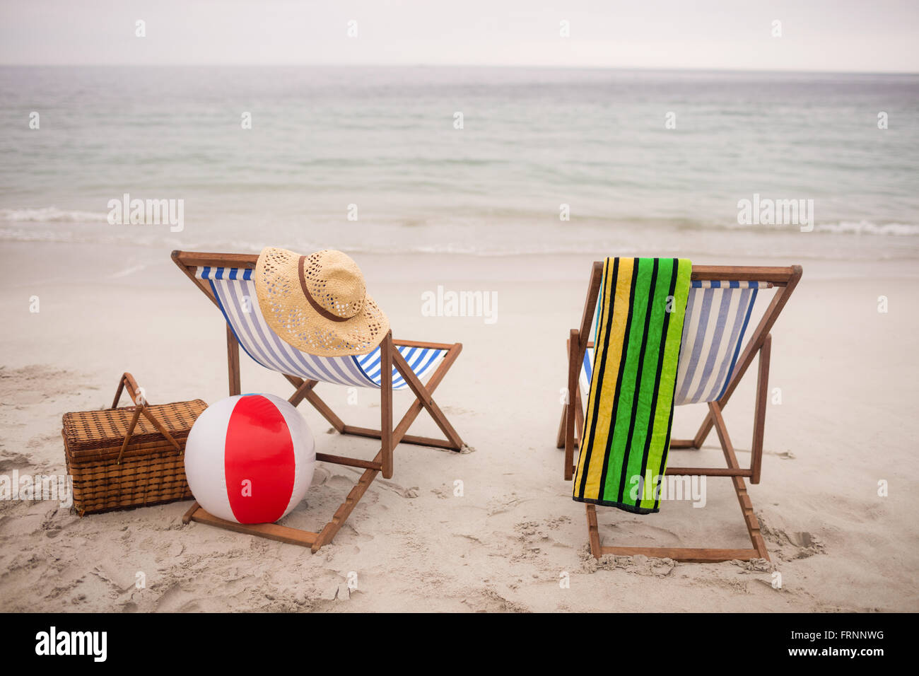 Empty deck chairs and star fish on the beach Stock Photo - Alamy