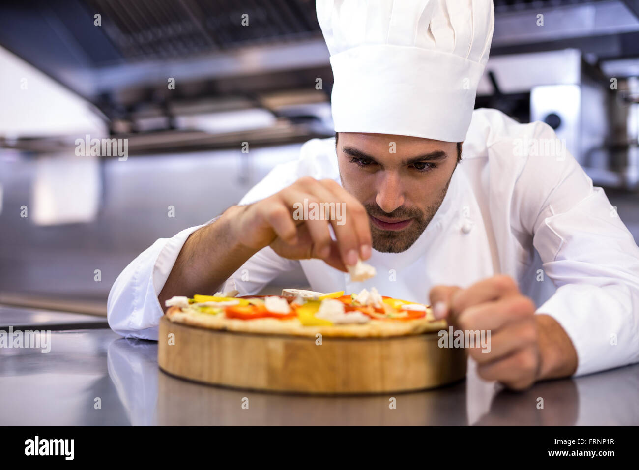 Pizza chef making pizza Stock Photo