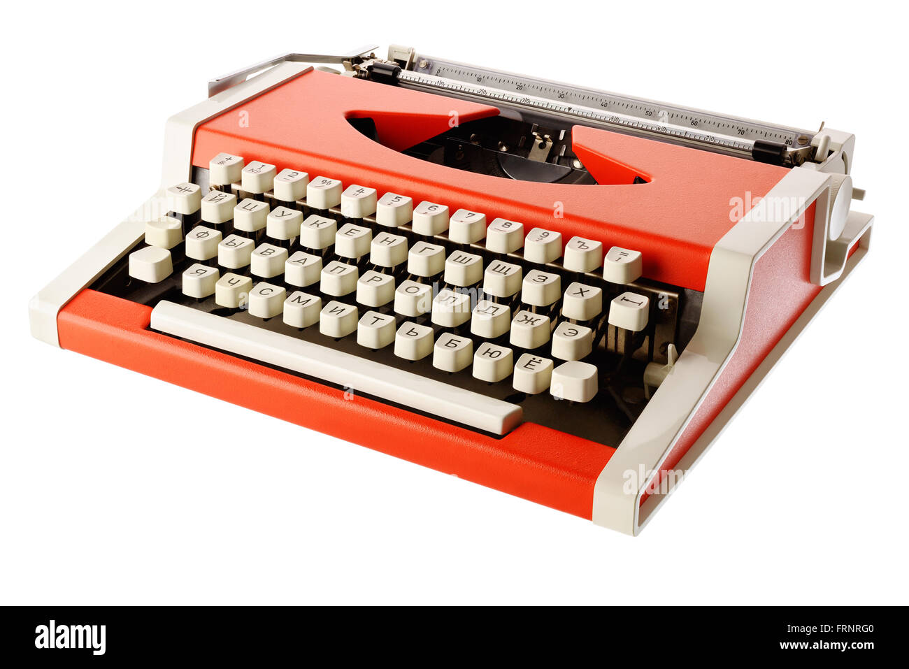 Isolated objects: little orange typewriter, on white background Stock Photo