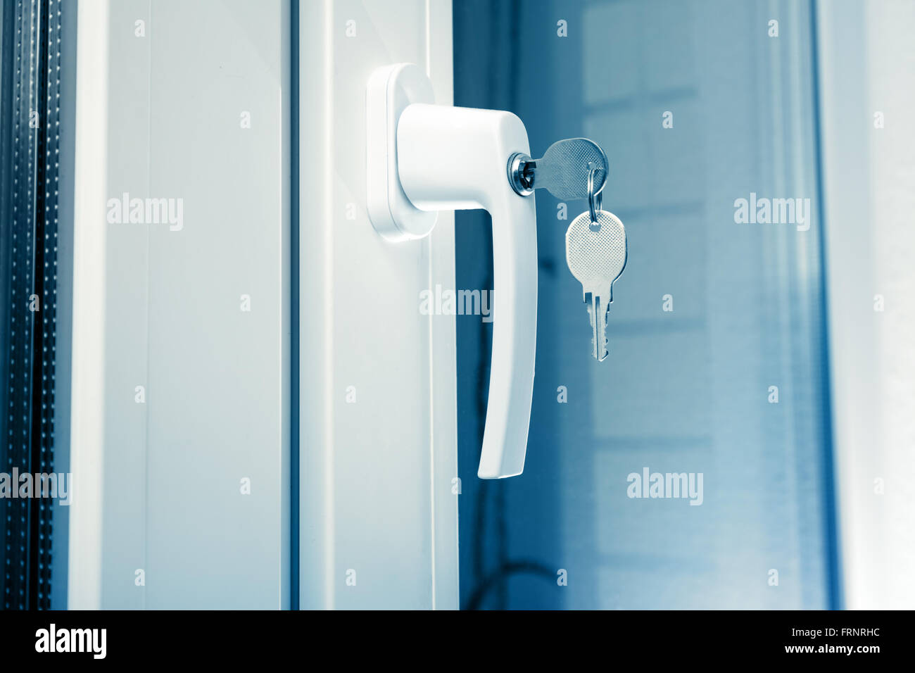 Handle plastic windows with keys in closeup Stock Photo Alamy