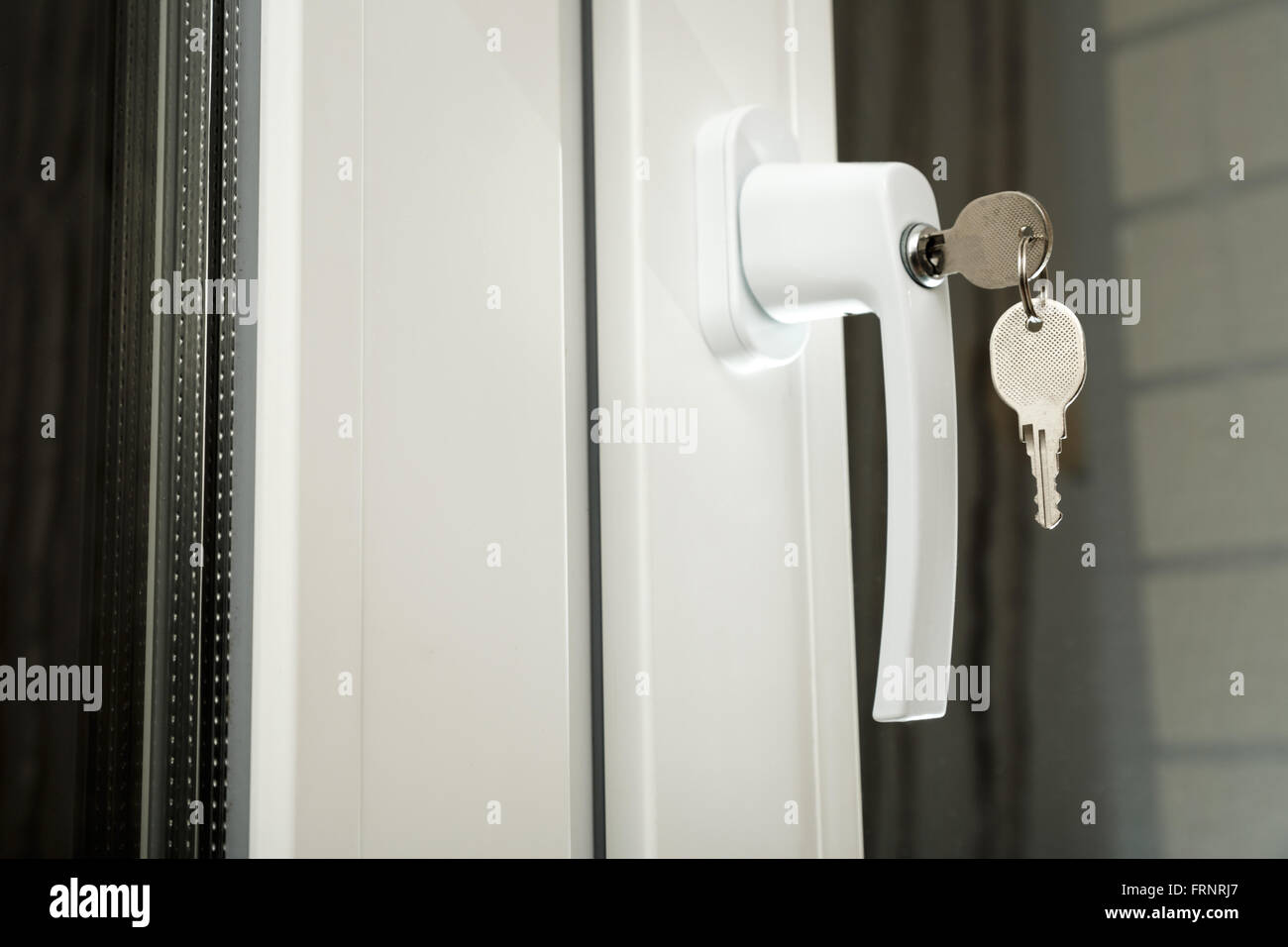 Handle plastic windows with keys in closeup Stock Photo Alamy