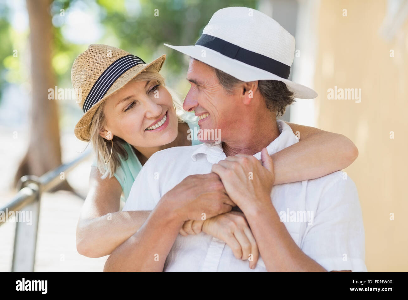 Couple enjoying city break while looking at each other Stock Photo