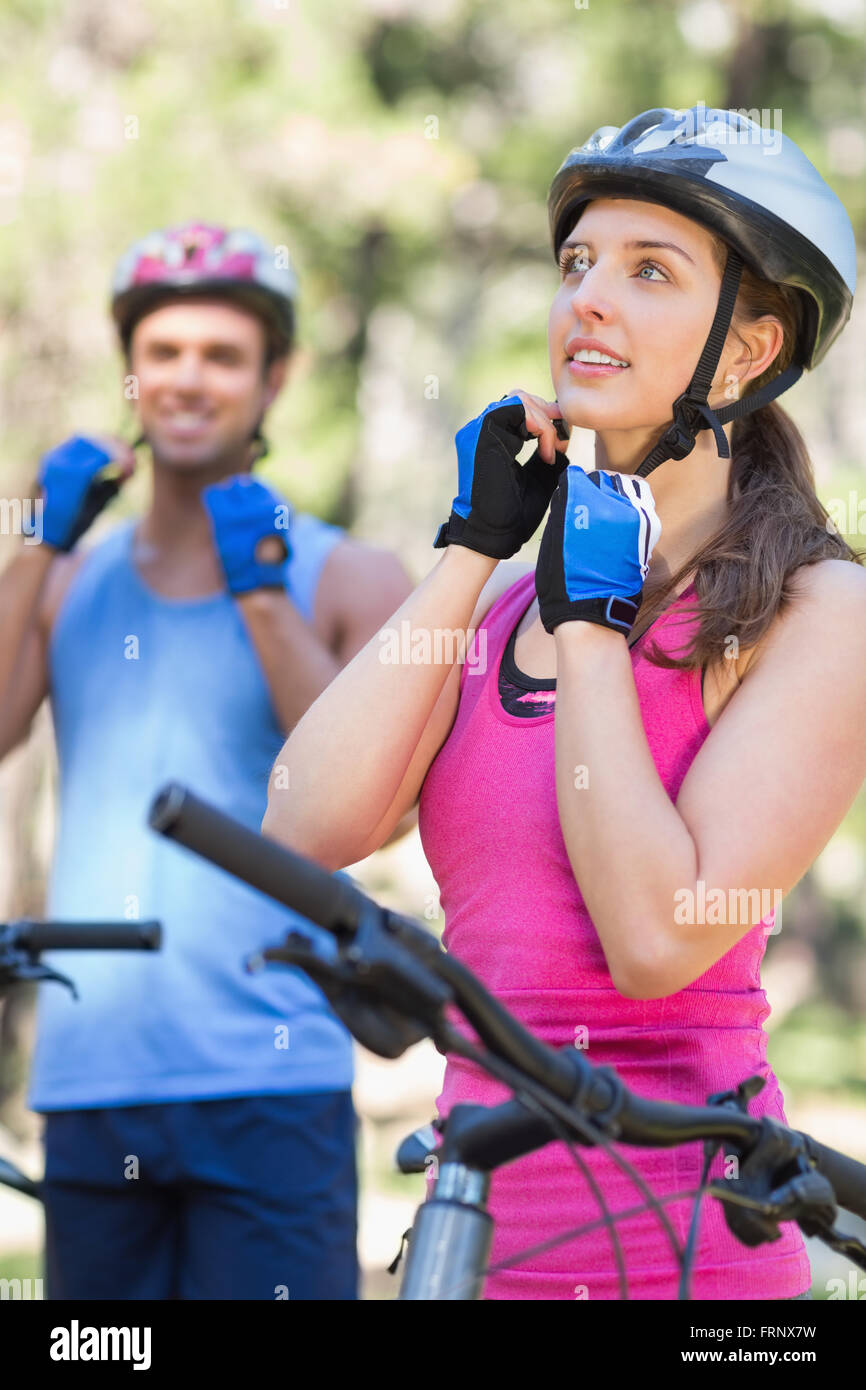 Male and female bikers wearing helmet Stock Photo