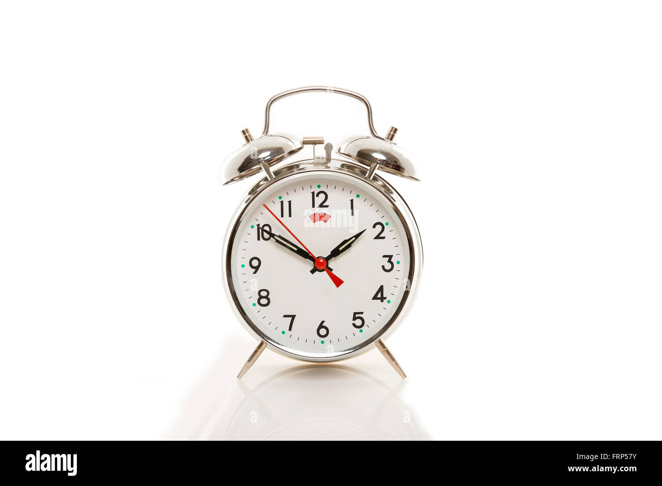 Mechanical alarm clock on a white background Stock Photo - Alamy