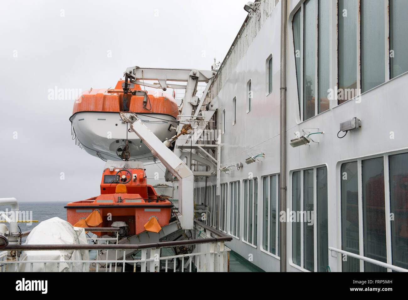 Orange lifeboat on the ferry ship MS Smyril on the Faroe Islands Stock