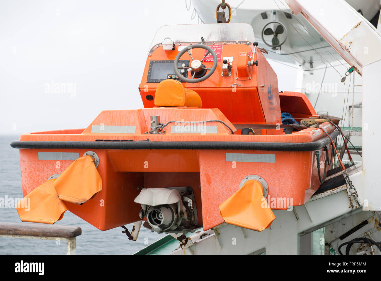 Orange lifeboat on the ferry ship MS Smyril on the Faroe Islands Stock