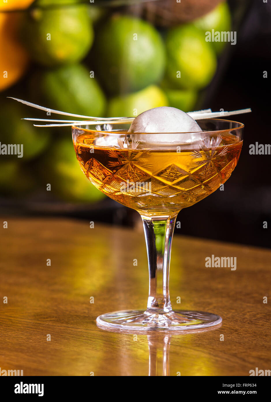 https://c8.alamy.com/comp/FRP634/alcoholic-beverage-based-on-bar-counter-with-balls-ice-cubes-FRP634.jpg