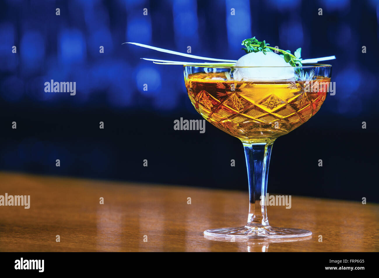 https://c8.alamy.com/comp/FRP6G5/alcoholic-beverage-based-on-bar-counter-with-balls-ice-cubes-FRP6G5.jpg