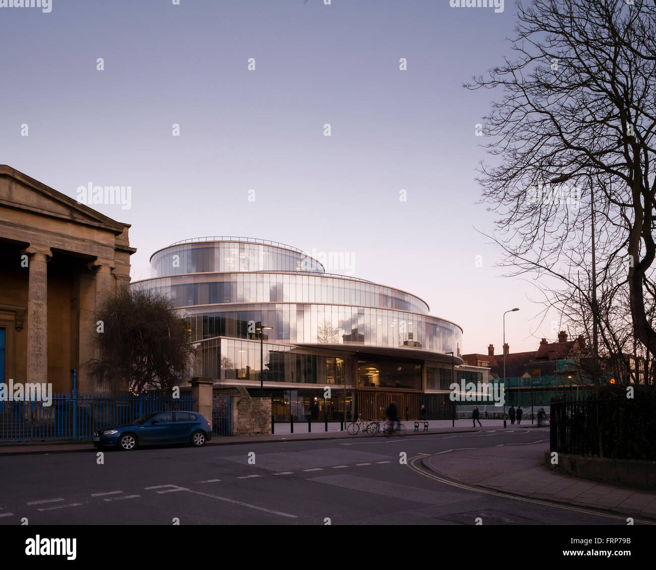 General view of front elevation from street at dusk. The Blavatnik School of Government at the University of Oxford, Oxford, Uni Stock Photo