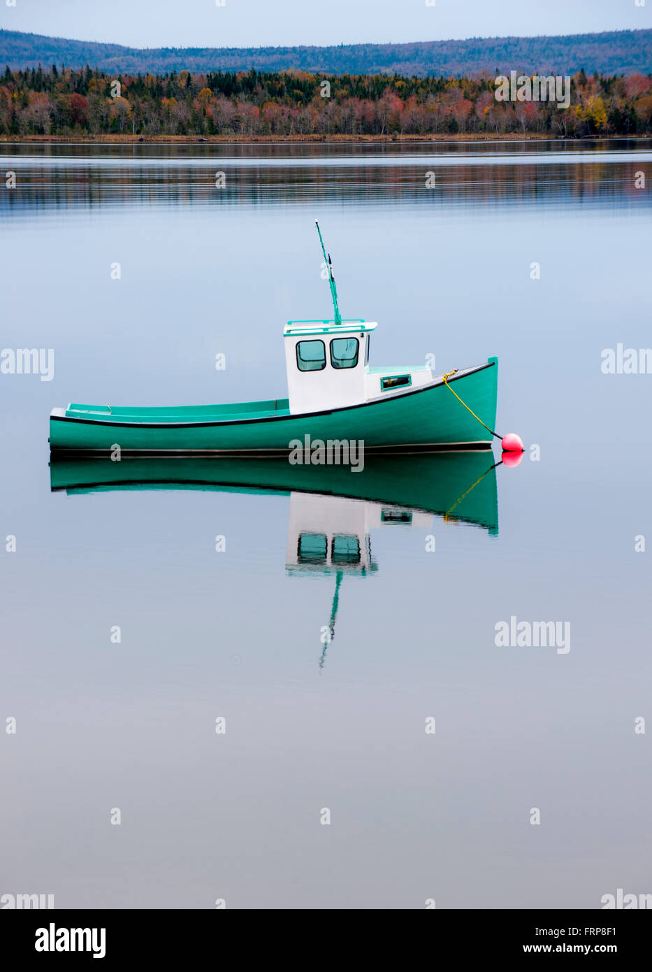 Small fishing boat anchored on Bras d'Or Lake, Cape Breton, Nova Scotia, Canada Stock Photo