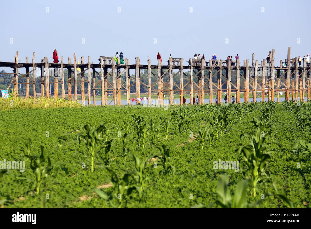 The U Bein Bridge across the Taungthaman Lake in Amarapura, Mandalay ...