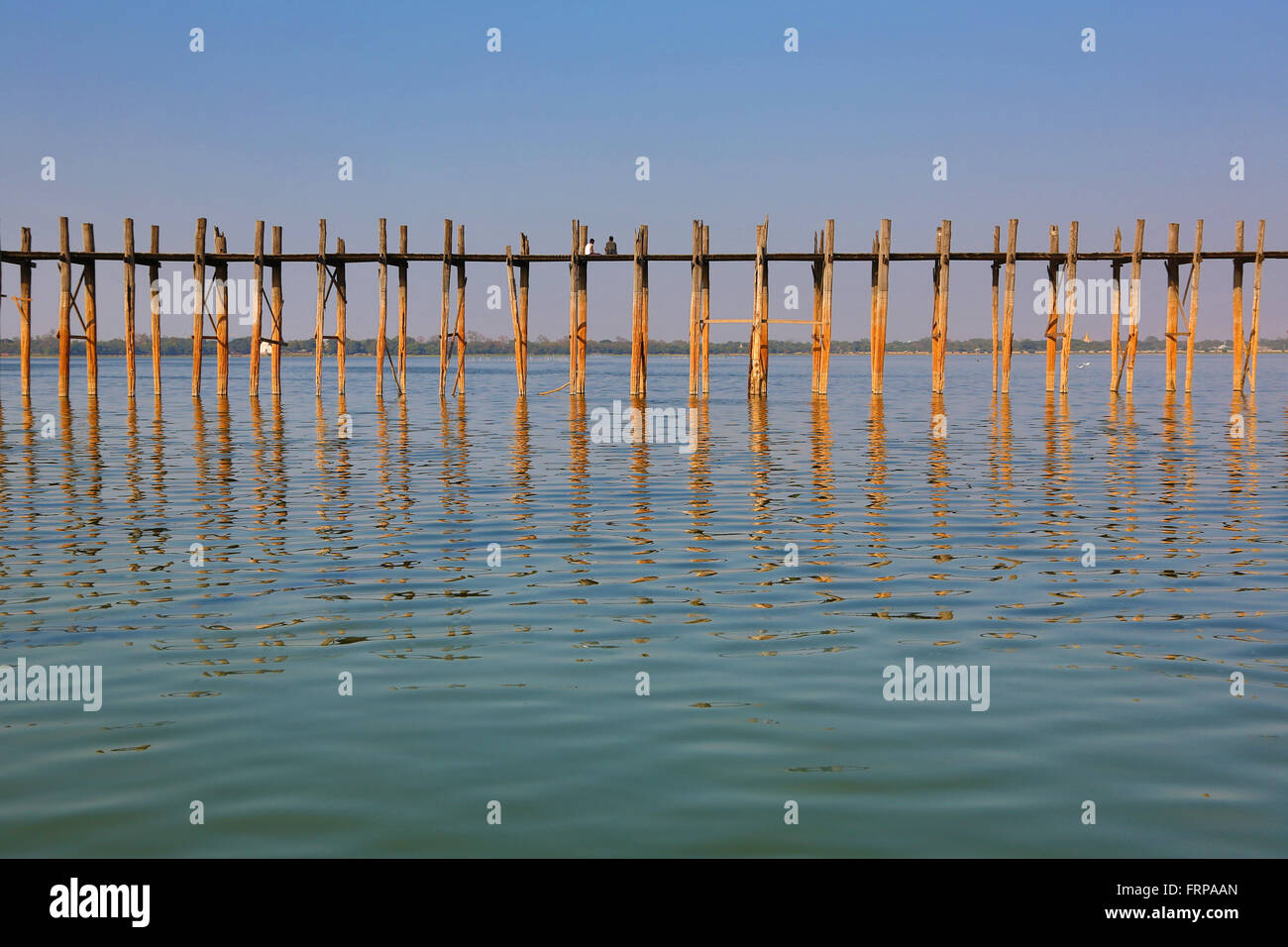 The U Bein Bridge across the Taungthaman Lake in Amarapura, Mandalay ...