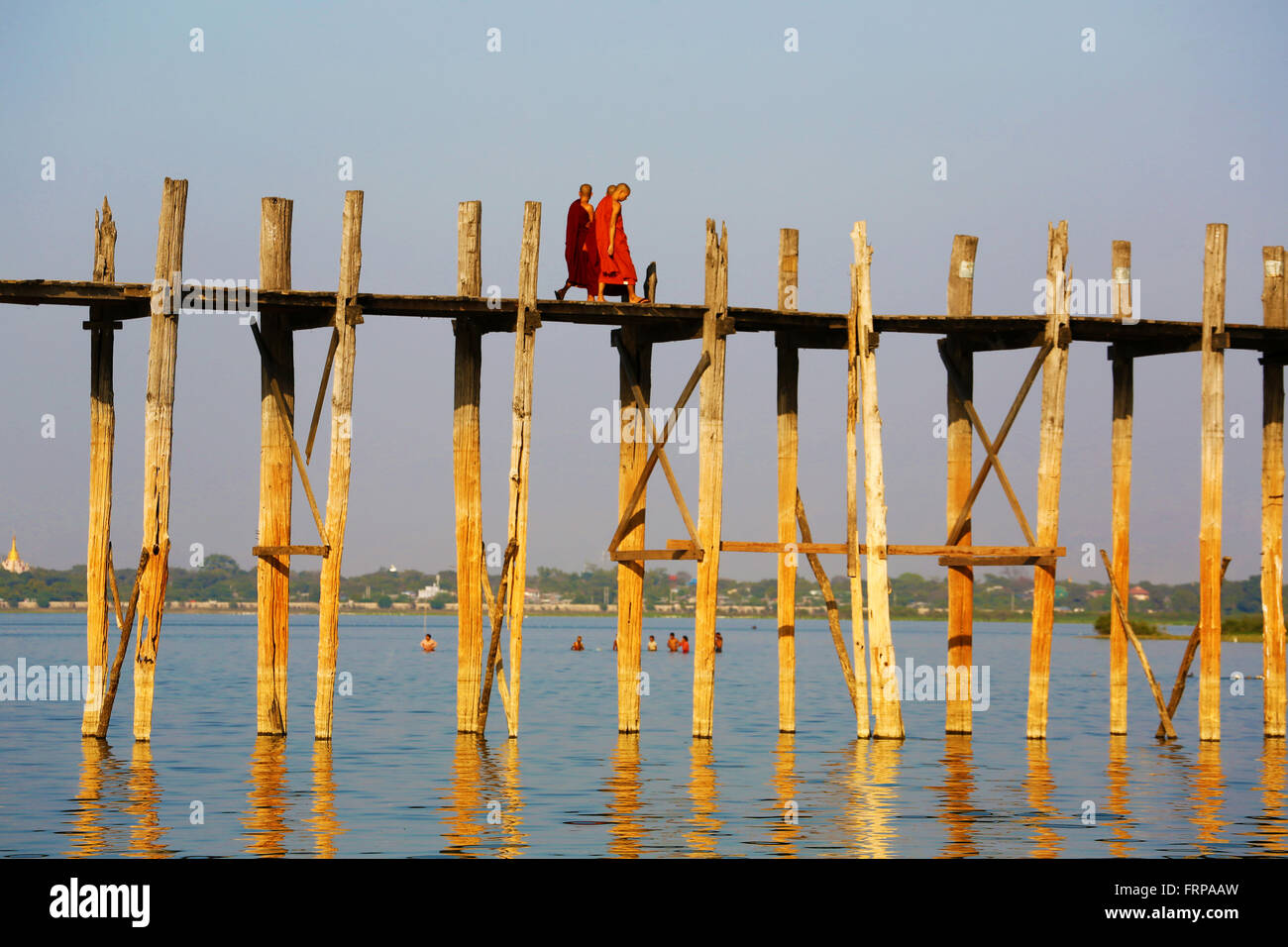 The U Bein Bridge across the Taungthaman Lake in Amarapura, Mandalay ...