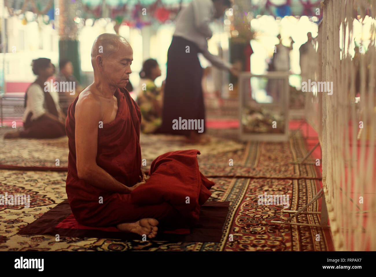 monks pray in temple Stock Photo