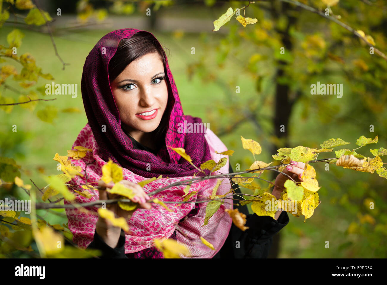 Girl in scarf at autumn park. Stock Photo